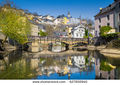 Stock-photo-classic-view-of-the-famous-old-town-of-luxembourg-city-reflecting-in-idyllic-alzette-river-on-a-627850940.jpg